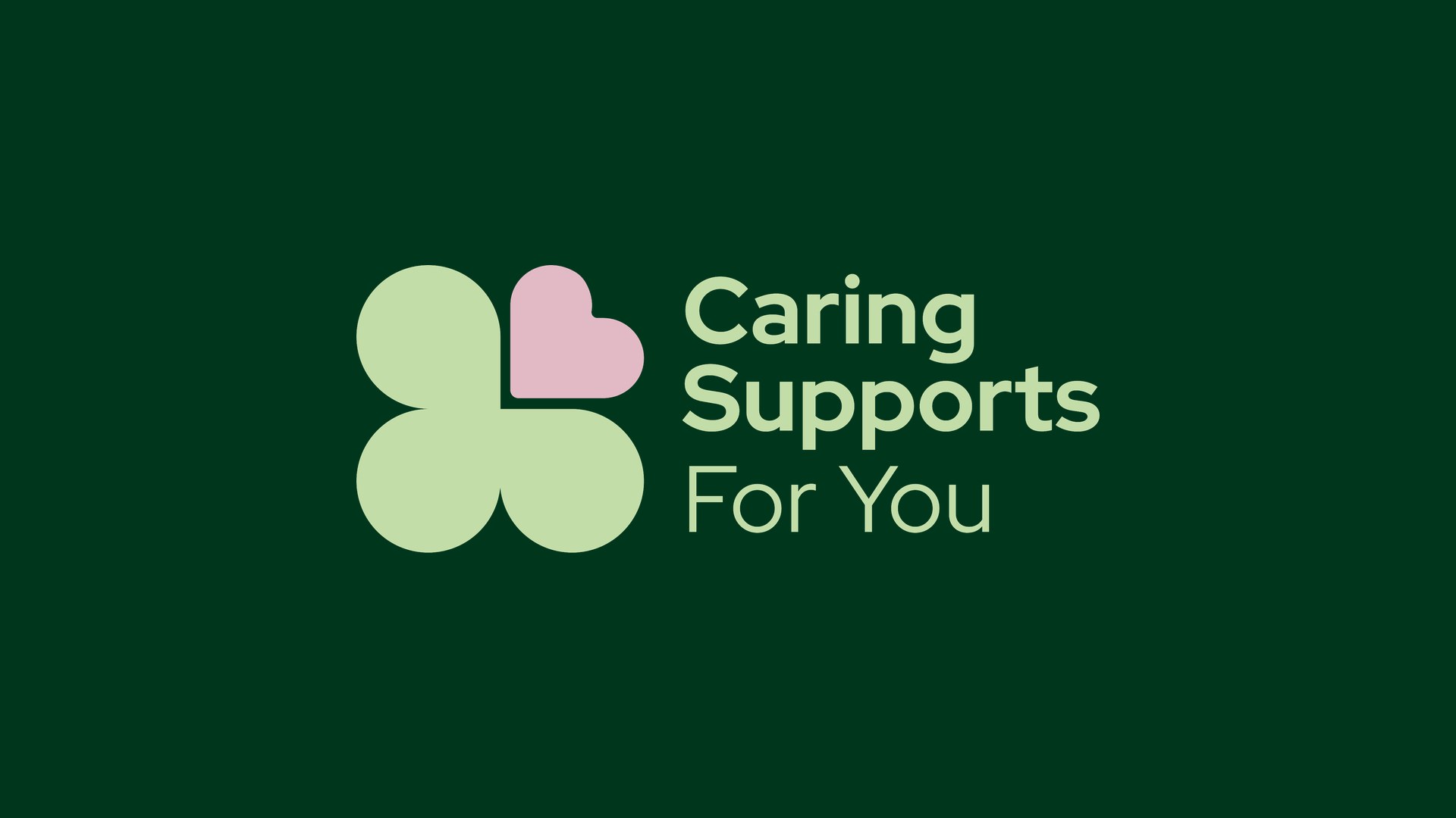 Caring Supports For You logo, a light green clover with a pink heart leaf, on dark green