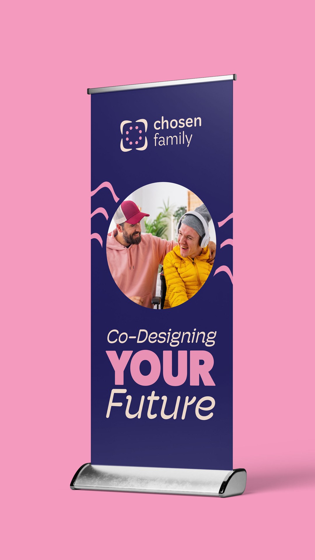 Pull-up banner reading Co-Designing Your Future with a photo of two people laughing together