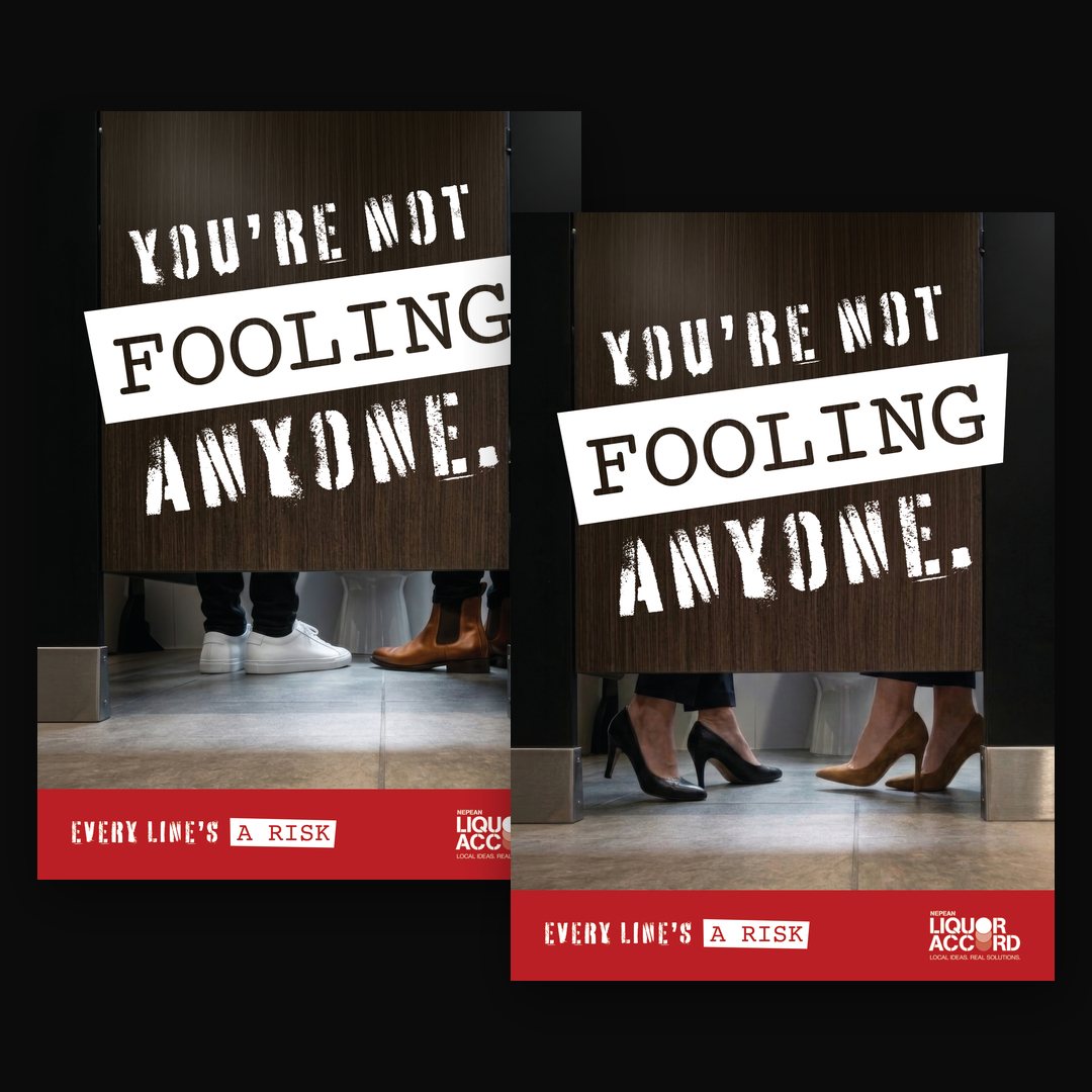 Two posters headed You're not fooling anyone, with a pair of feet under a cubicle door
