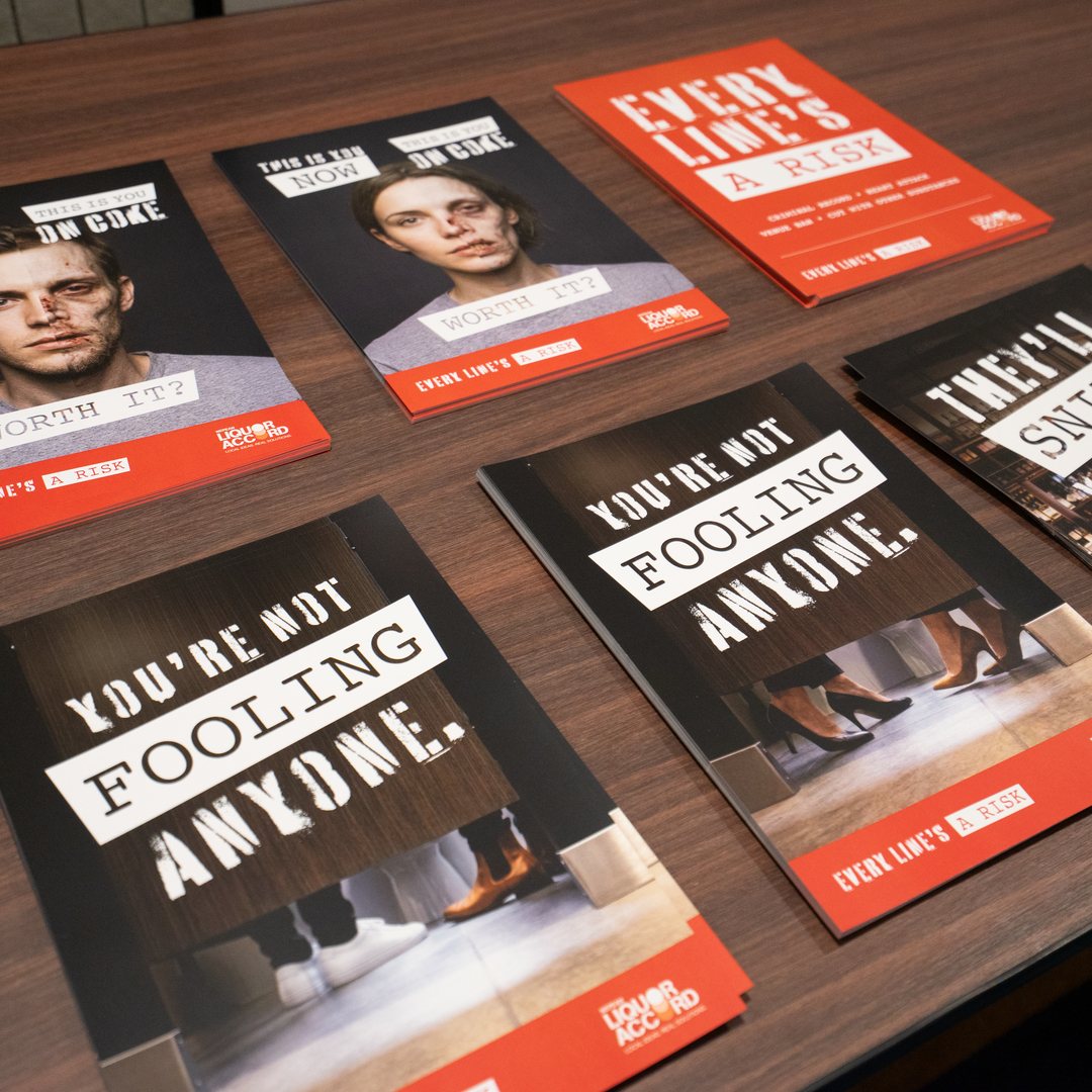 Campaign brochures laid out on a timber table
