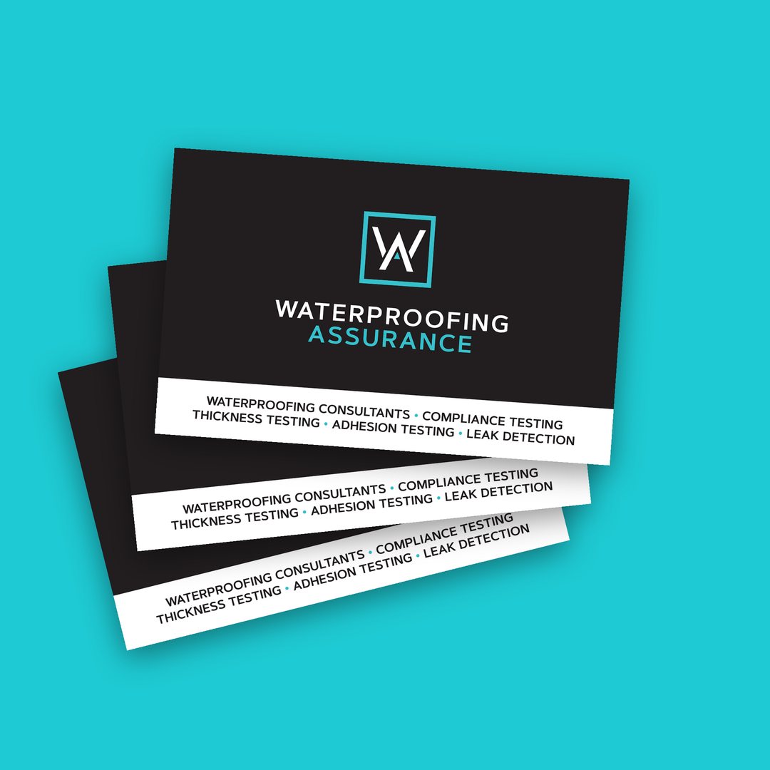 Stack of business cards with a services strip across the bottom